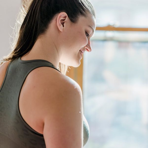 Person feeling refreshed and happy after a light workout session.
